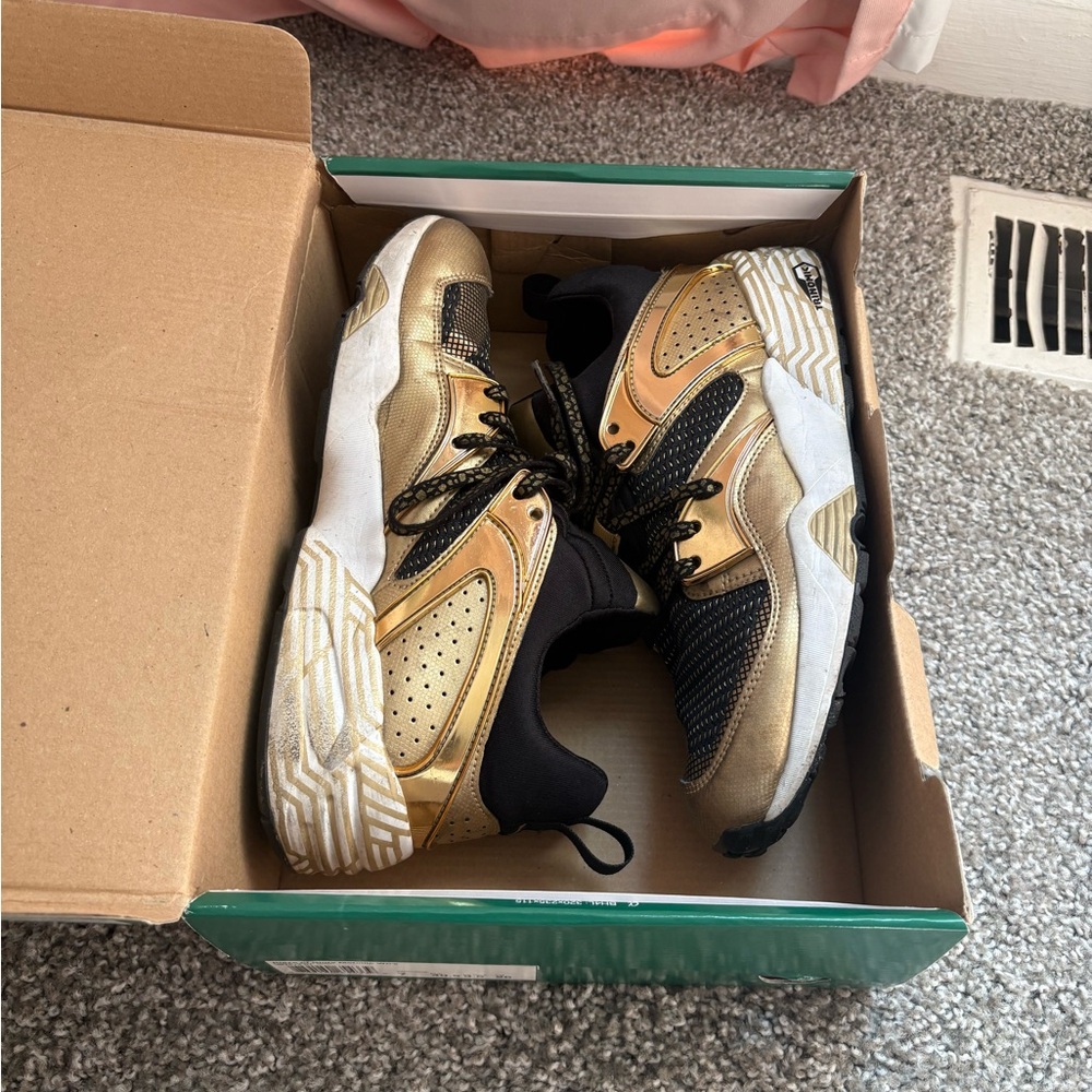 Puma Metallic Black and Gold Sneakers